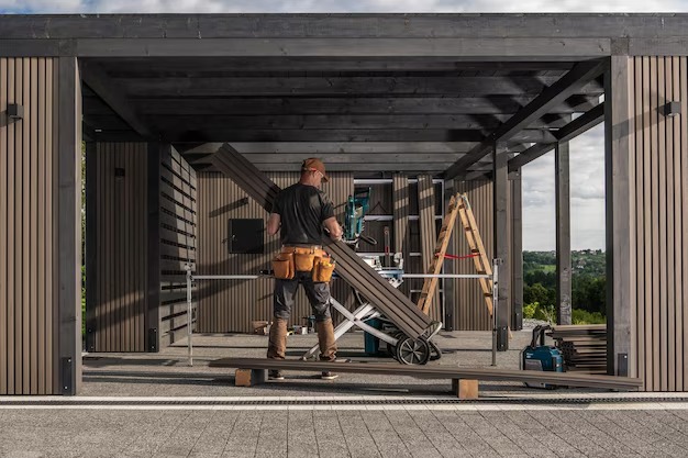 construction-worker-assembling-wooden-carport-structure-outdoor-site-sunny-day_1426-26223.jpg